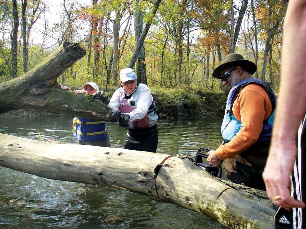  Tutman on the Patuxent with volunteers Ken Hastings and Will Wallace clearing snags. Courtesy of Fred Tutman.  