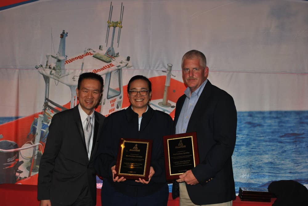  Captain Dale Plummer (right) accepts the award from BoatUS 