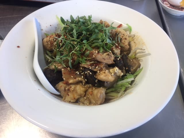  Top: Chef Jeff Eng cooks up a delicious blue catfish dish. Bottom: The finished product, as served to spectators. 