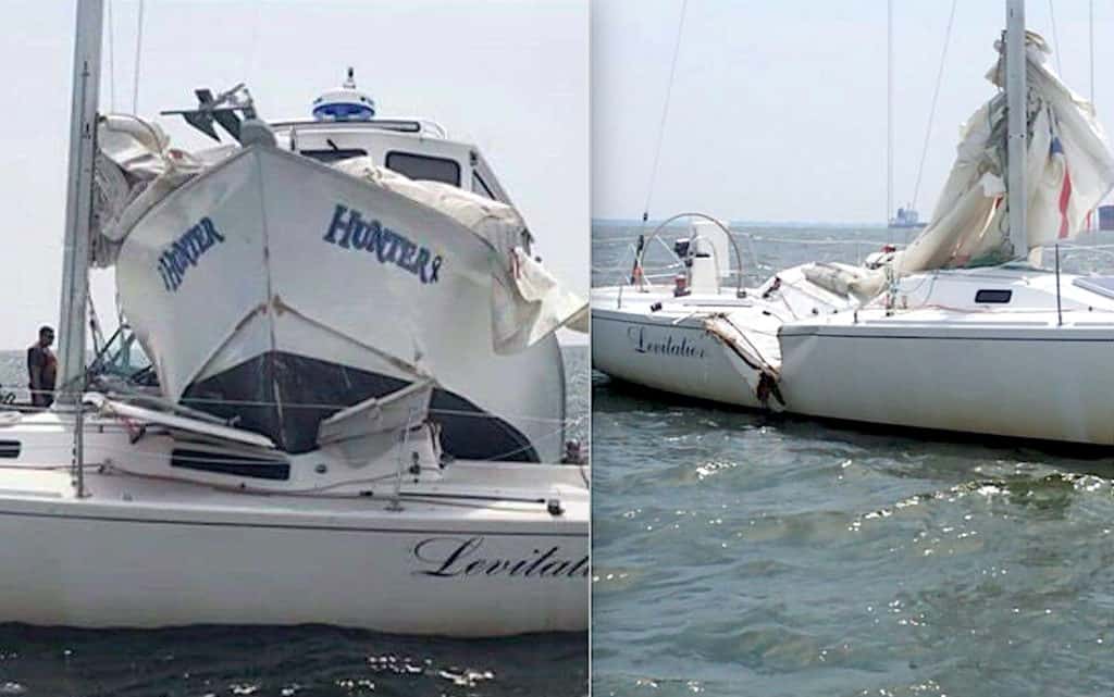 sailboat on a collision course with a fishing boat