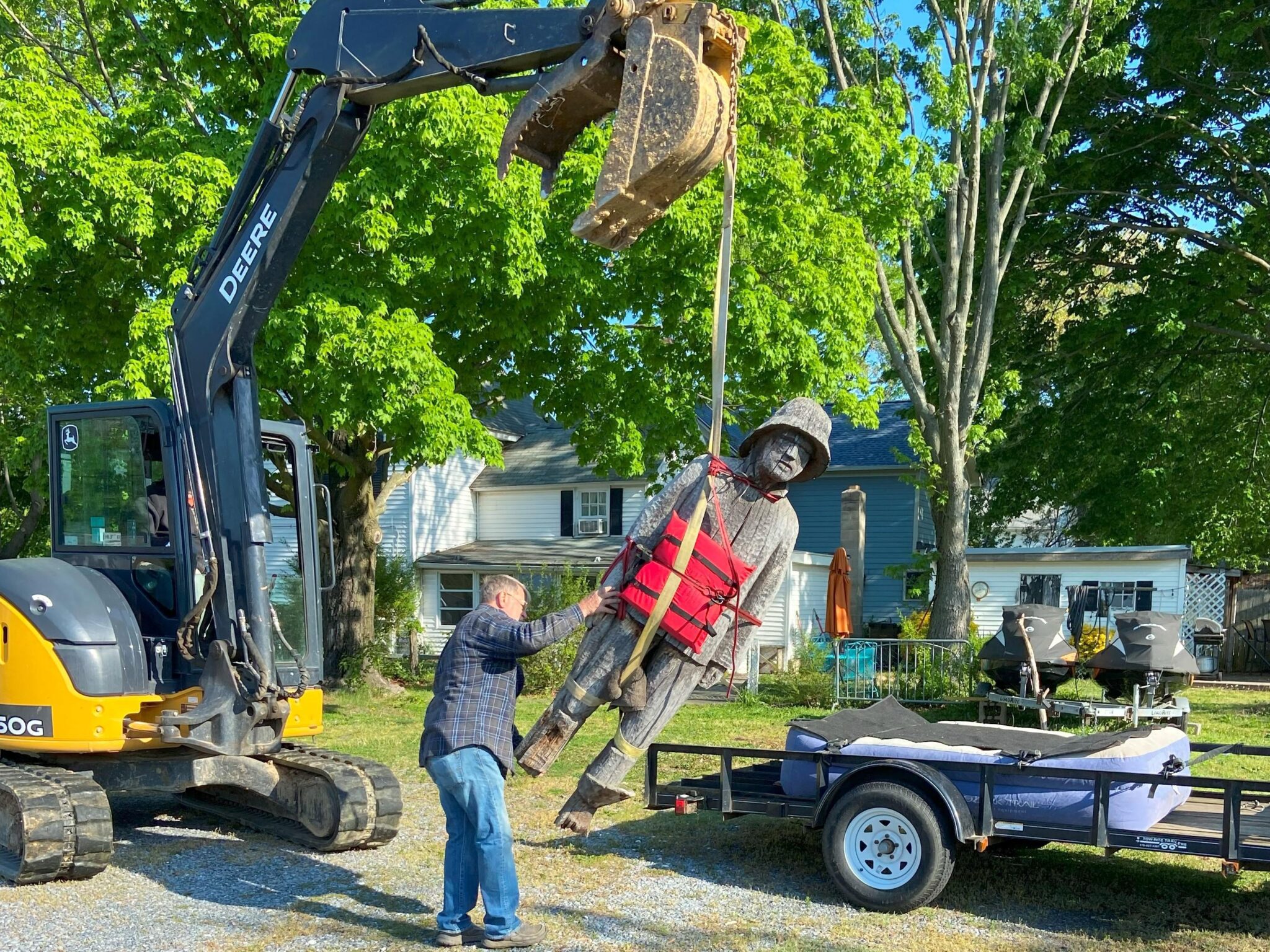 Statue Hoisting Rock Hall's Beloved